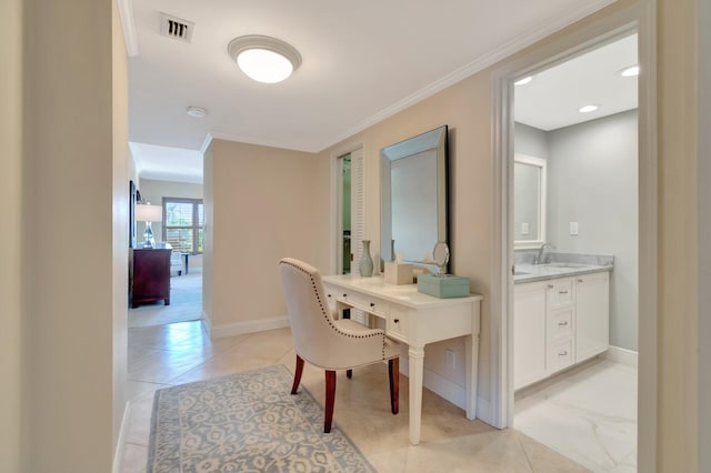 office area with ornamental molding and sink