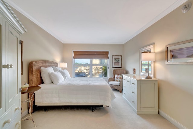 carpeted bedroom featuring crown molding