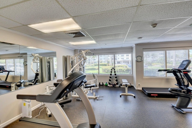 gym with a paneled ceiling