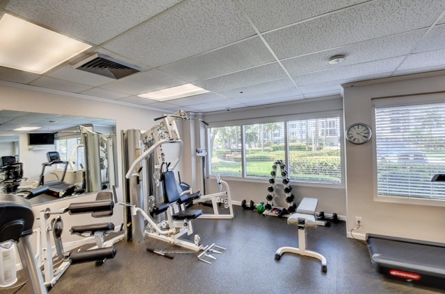 exercise room with a drop ceiling