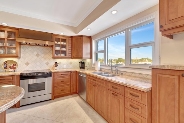 kitchen featuring appliances with stainless steel finishes, ornamental molding, sink, exhaust hood, and light tile patterned floors