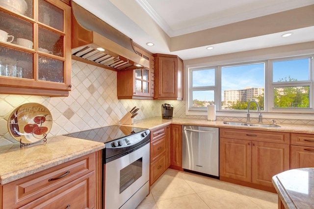 kitchen featuring custom exhaust hood, sink, tasteful backsplash, light tile patterned flooring, and stainless steel appliances