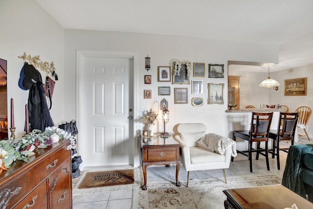 entryway with light tile patterned floors