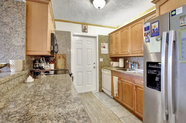 kitchen with stainless steel refrigerator with ice dispenser, white dishwasher, a sink, light tile patterned floors, and decorative backsplash