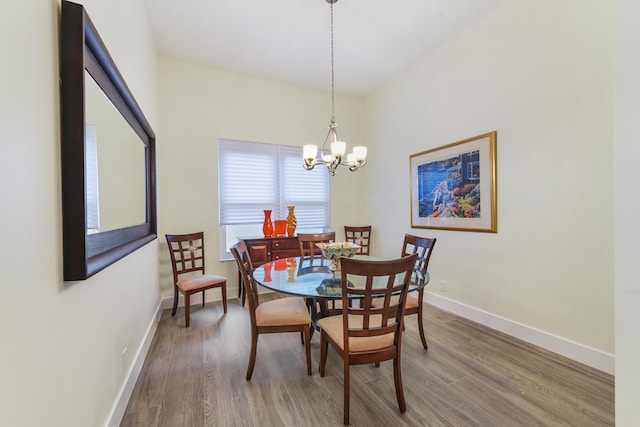 dining room featuring an inviting chandelier and wood-type flooring