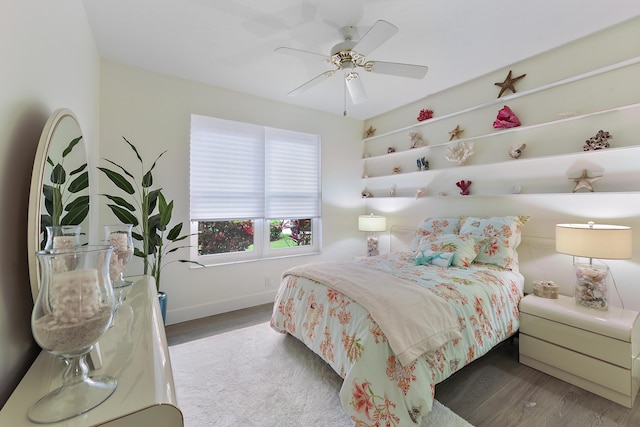 bedroom featuring dark hardwood / wood-style flooring and ceiling fan