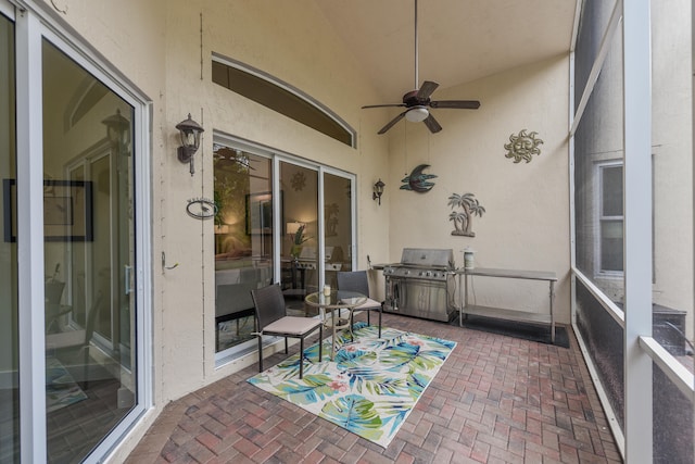 sunroom / solarium with vaulted ceiling and ceiling fan