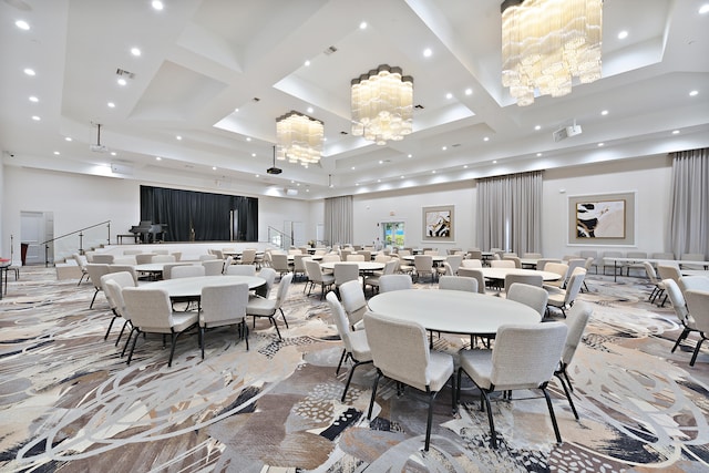 dining area featuring a towering ceiling, a chandelier, and coffered ceiling