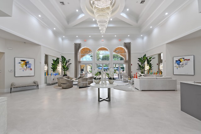 living room featuring a towering ceiling, a notable chandelier, coffered ceiling, ornamental molding, and beam ceiling