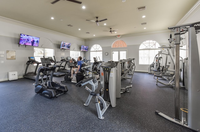 exercise room featuring ceiling fan and crown molding