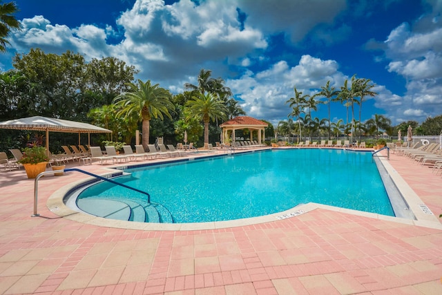 view of pool featuring a patio and a gazebo