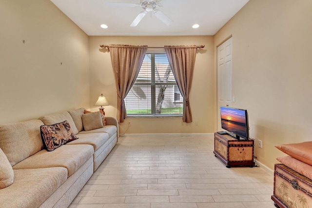 living room featuring light hardwood / wood-style floors and ceiling fan