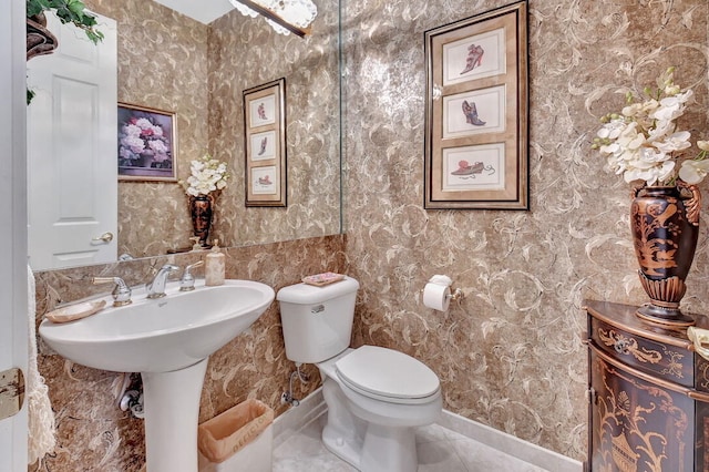 bathroom featuring sink and toilet