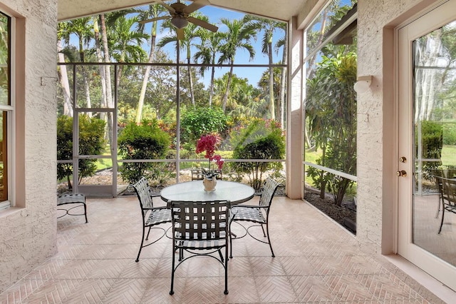 sunroom featuring ceiling fan