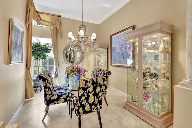 dining area with a chandelier, light tile patterned floors, and crown molding