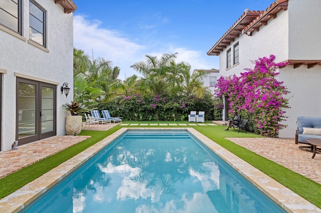 view of pool featuring a patio area