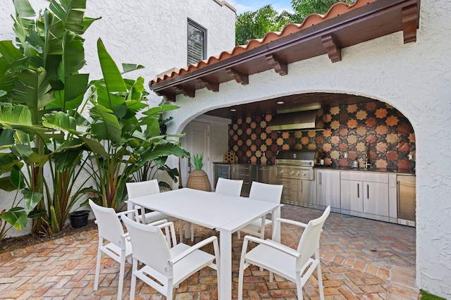 view of patio featuring sink and area for grilling