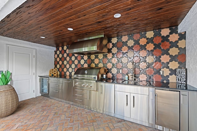 kitchen featuring beverage cooler, wall chimney exhaust hood, wooden ceiling, and stainless steel fridge