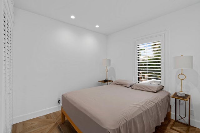 bedroom featuring parquet floors