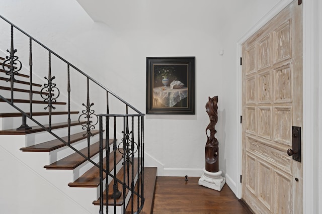 stairs with wood-type flooring