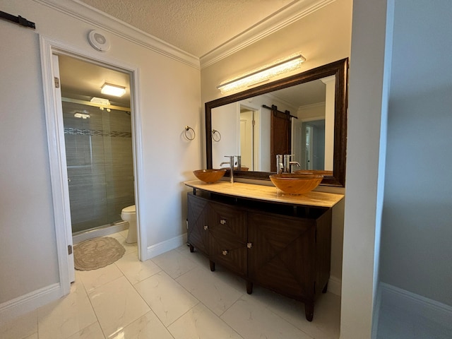 bathroom with walk in shower, ornamental molding, a textured ceiling, vanity, and toilet