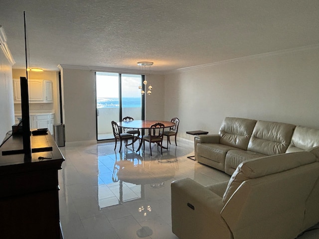 tiled living room with a textured ceiling, a water view, and crown molding