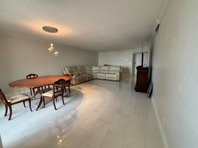 dining space with a textured ceiling and ornamental molding