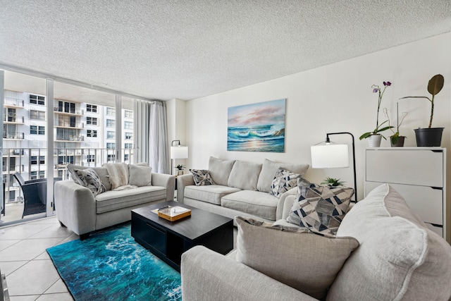 living room featuring a textured ceiling and tile patterned floors