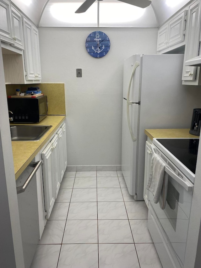 kitchen with white cabinets, white electric range, light tile patterned floors, and dishwasher