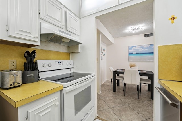 kitchen with range hood, white cabinetry, white range with electric stovetop, a textured ceiling, and light tile patterned floors