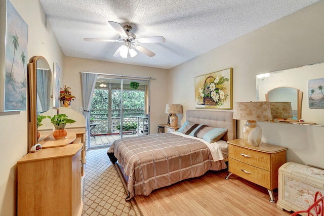 bedroom featuring light wood-type flooring, a textured ceiling, ceiling fan, and access to exterior