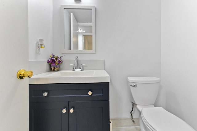 bathroom with toilet and vanity