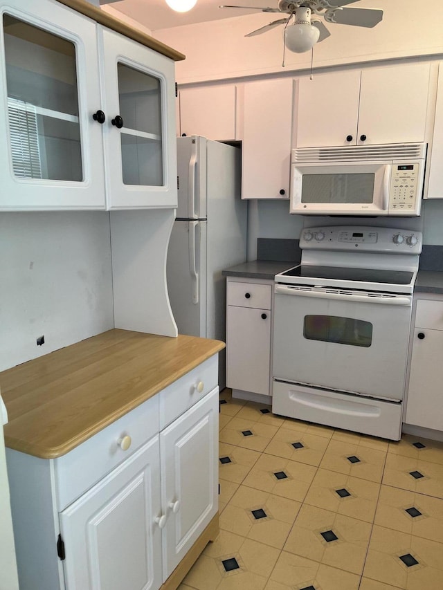 kitchen featuring white cabinetry, white appliances, light tile patterned floors, and ceiling fan