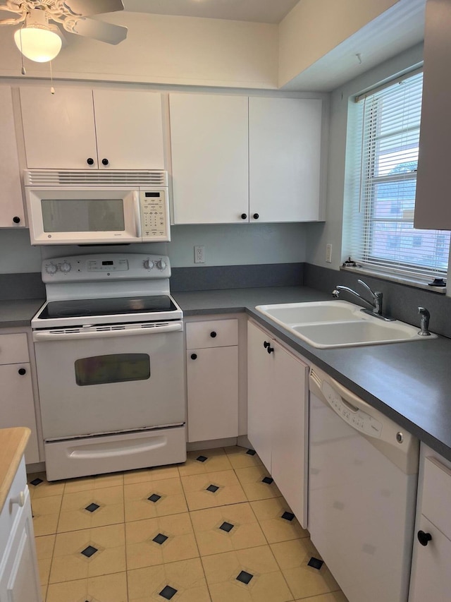 18081 SE Country Club Dr Unit 17Apt 167, Tequesta, FL 33469 - kitchen with white appliances, white cabinets, and light tile patterned flooring