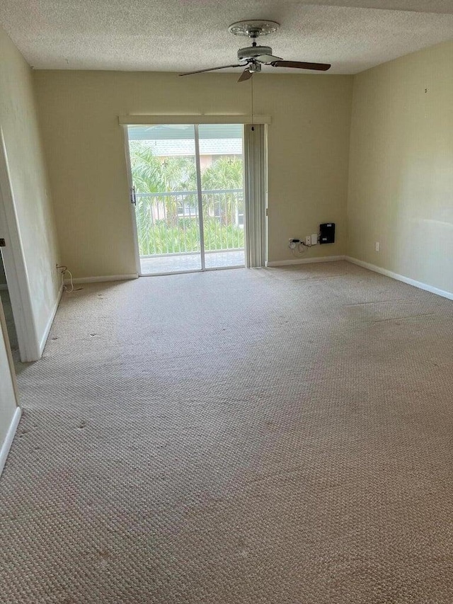 18081 SE Country Club Dr Unit 17Apt 167, Tequesta, FL 33469 - carpeted spare room with a textured ceiling and ceiling fan