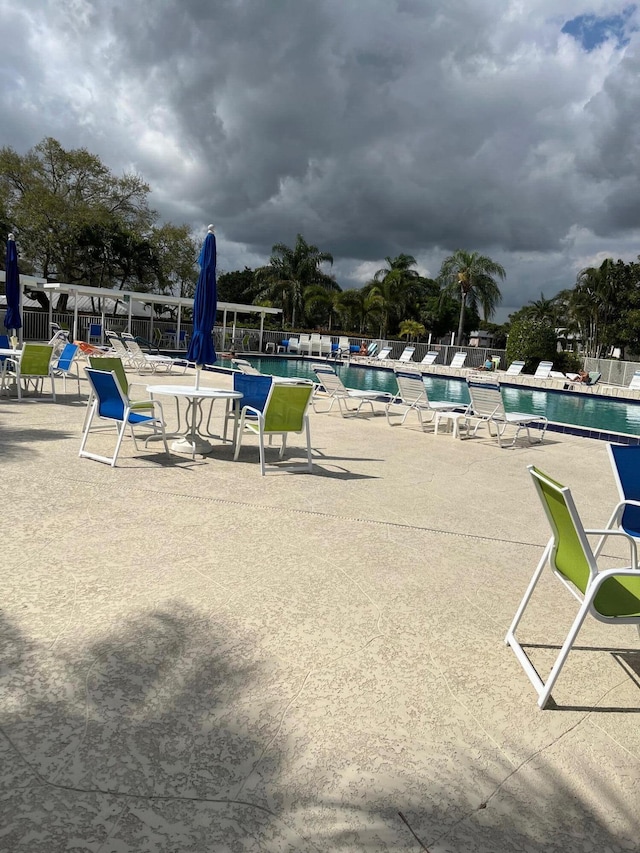 view of swimming pool featuring a patio area