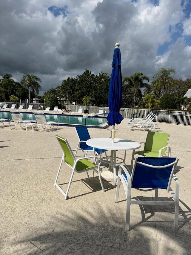 18081 SE Country Club Dr Unit 17Apt 167, Tequesta, FL 33469 - community pool with a patio area