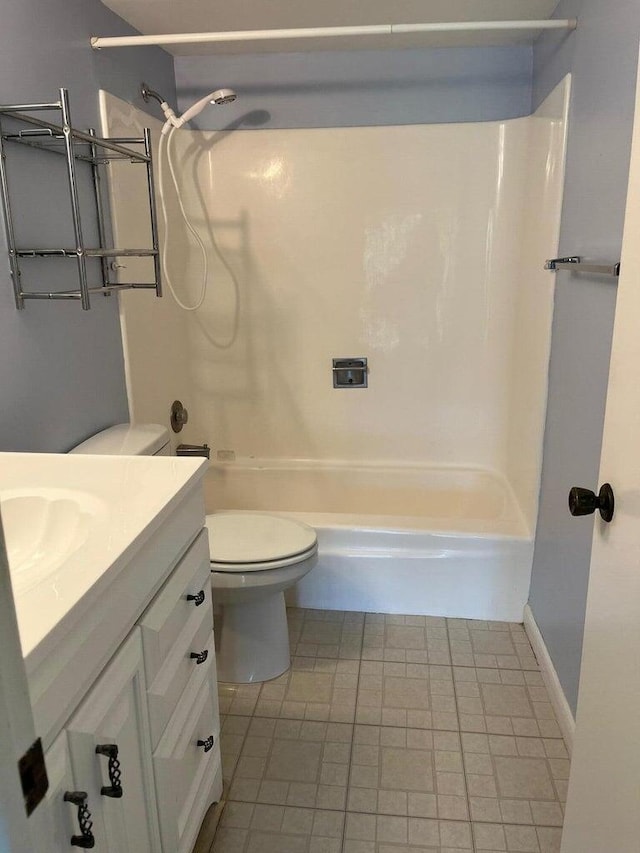 full bathroom with tile patterned flooring, shower / bath combination, vanity, and toilet