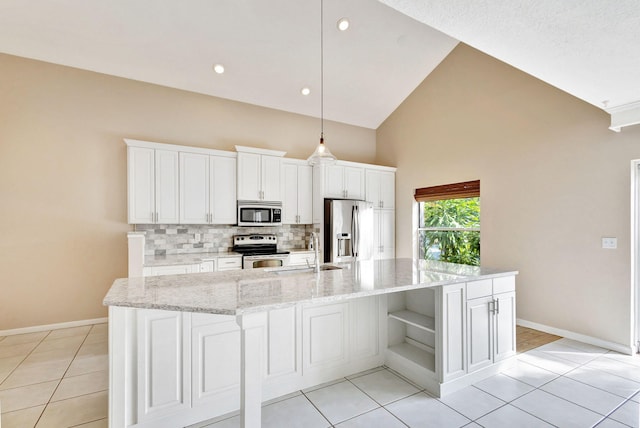 kitchen with sink, a center island with sink, white cabinets, and appliances with stainless steel finishes