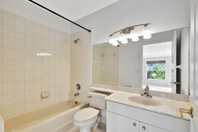 full bathroom with tile patterned flooring, vanity, tiled shower / bath combo, and toilet