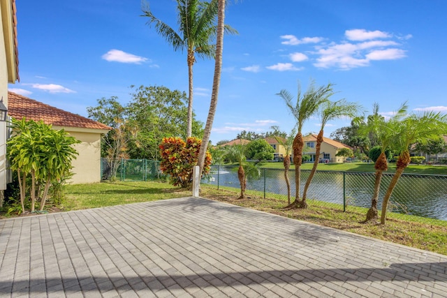 view of patio featuring a water view