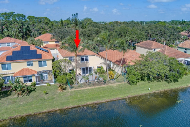 birds eye view of property featuring a water view