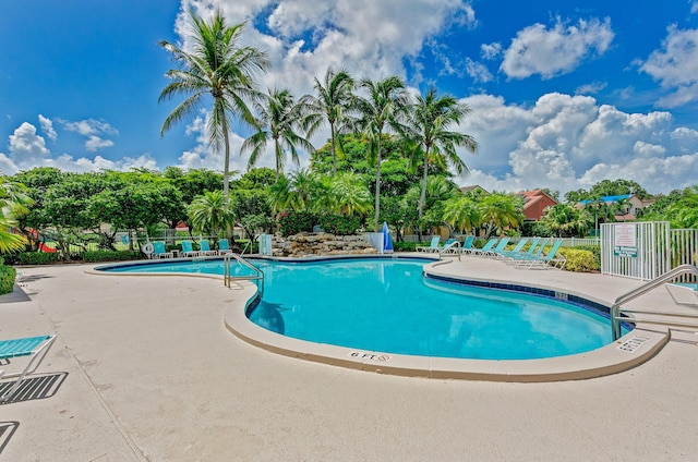 view of swimming pool with a patio