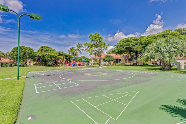 view of home's community featuring a playground and a yard