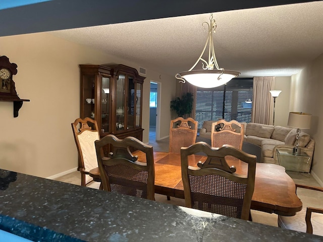 dining area with a textured ceiling