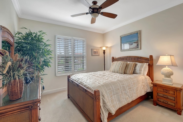 bedroom with ceiling fan, crown molding, and light carpet