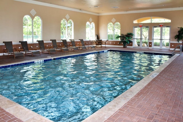 view of pool featuring french doors