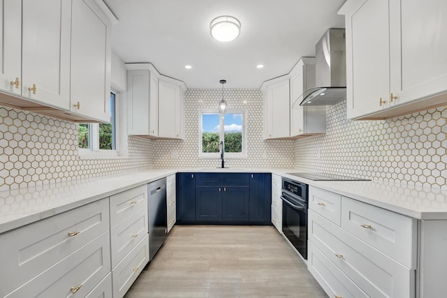 524 Lighthouse Dr, North Palm Beach, FL 33408 - kitchen with wall chimney exhaust hood, black appliances, a sink, plenty of natural light, and recessed lighting