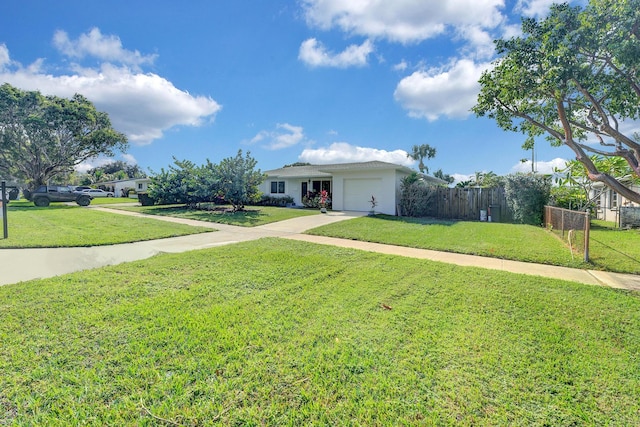 ranch-style house with a garage and a front yard