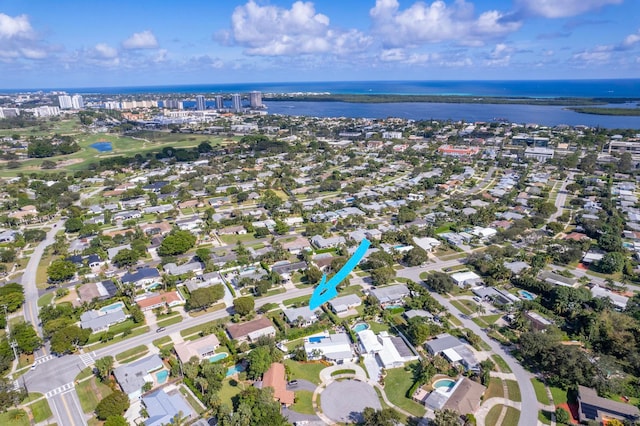 birds eye view of property with a water view